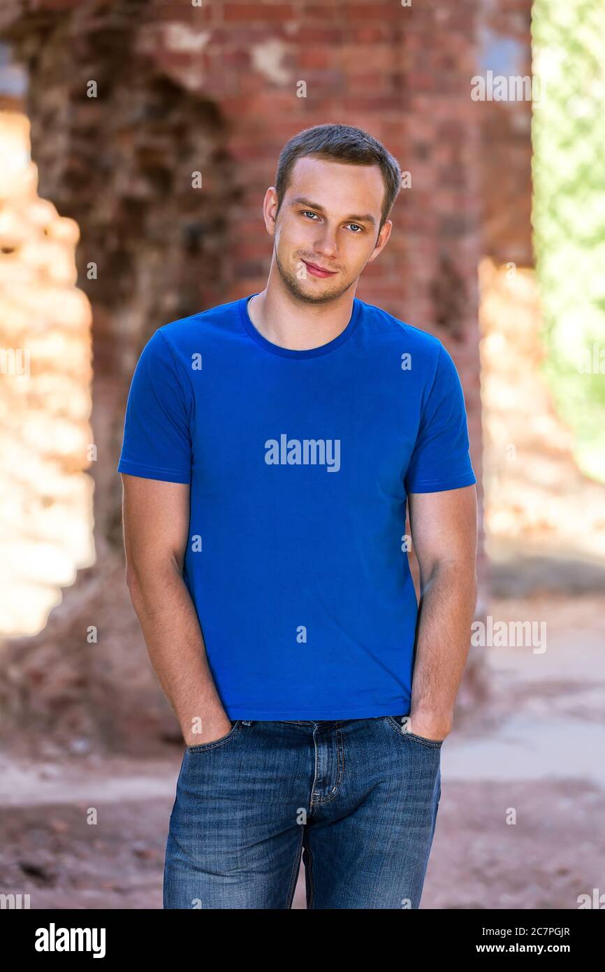 handsome happy young man smiling Stock Photo