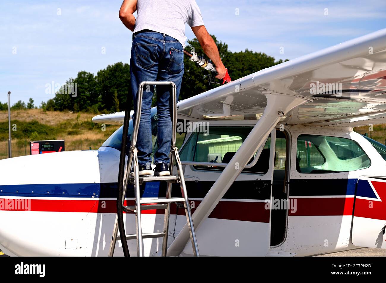 A private plane on the tarmac being refueled Stock Photo
