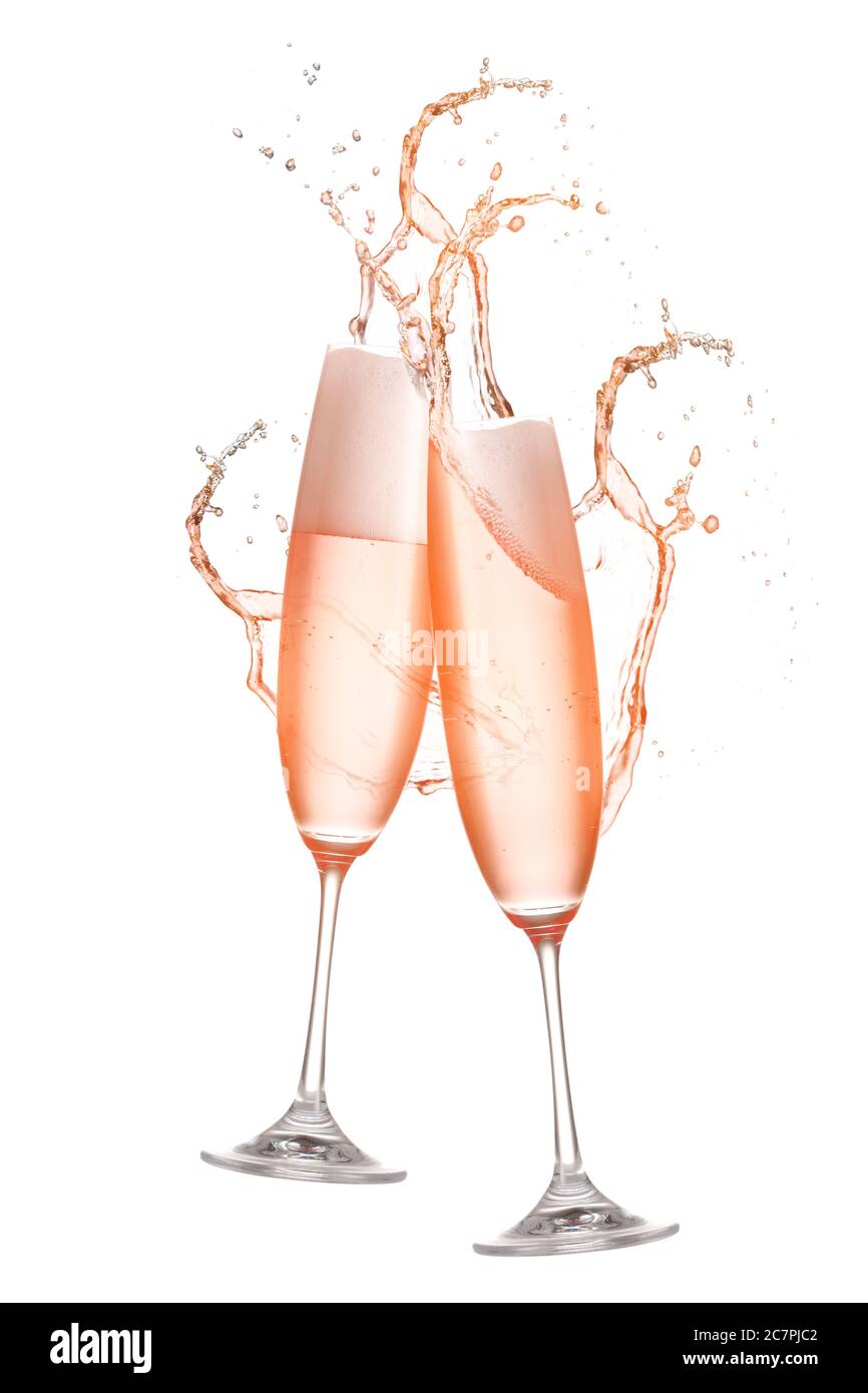 Clinking glasses of champagne with splash on white background Stock