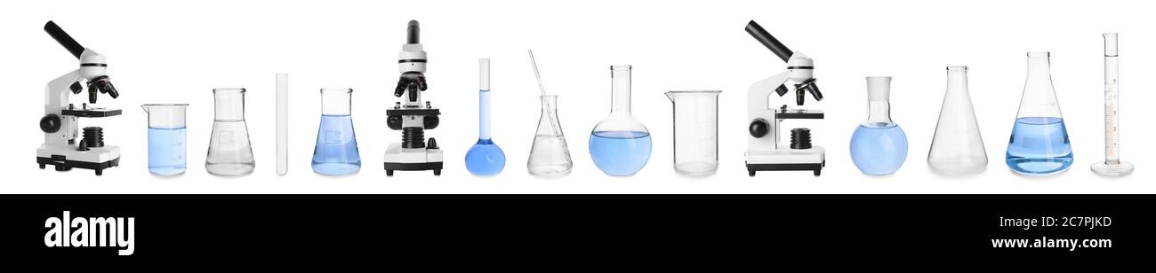 Set of laboratory glassware and microscopes on white background Stock Photo