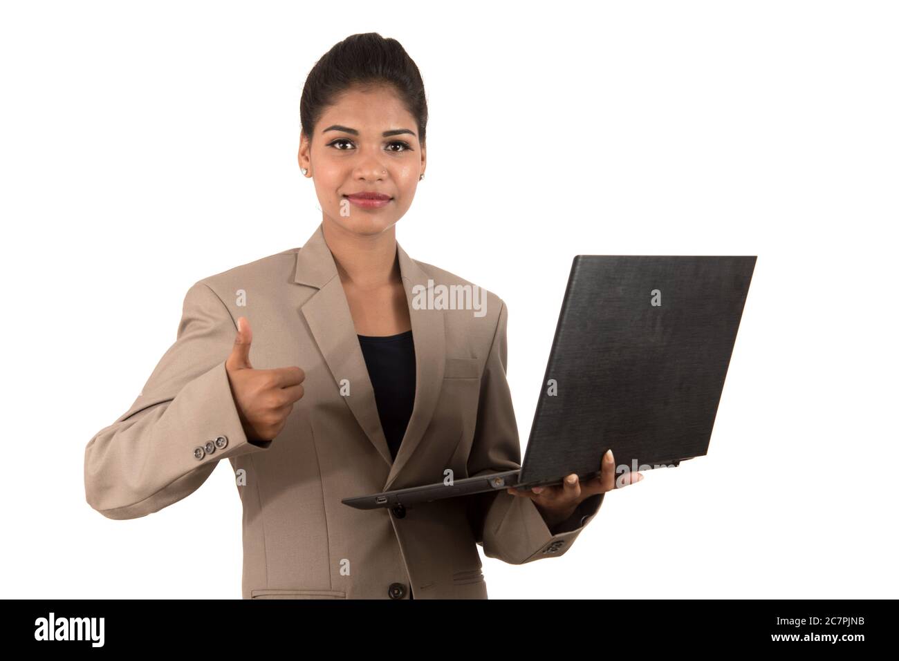 Happy excited business woman holding laptop and showing thumbs up ...