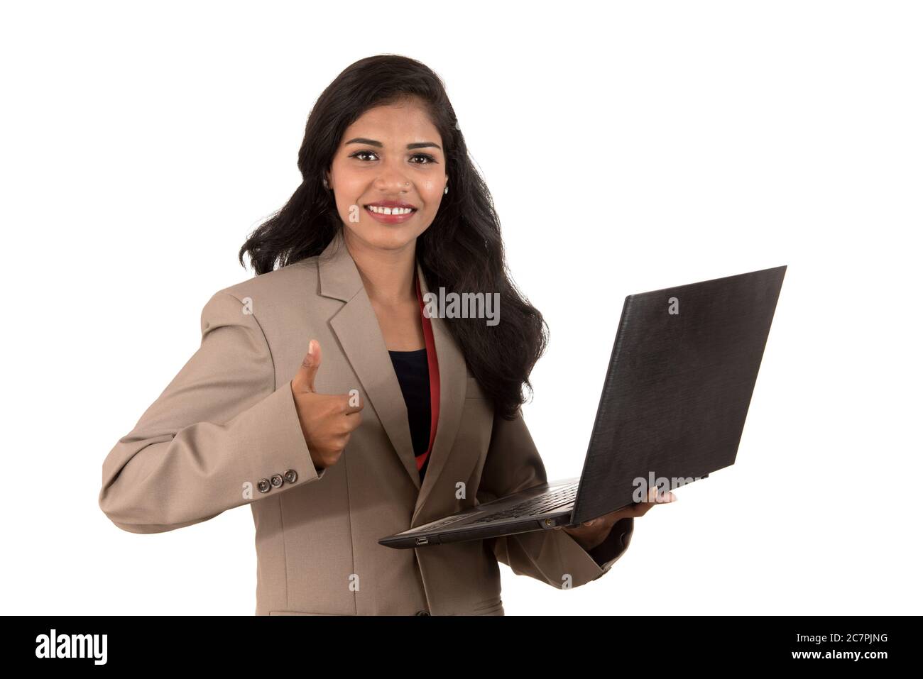 Happy excited business woman holding laptop and showing thumbs up ...