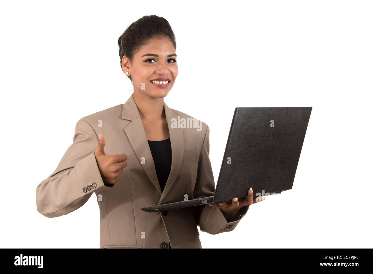 Happy excited business woman holding laptop and showing thumbs up ...