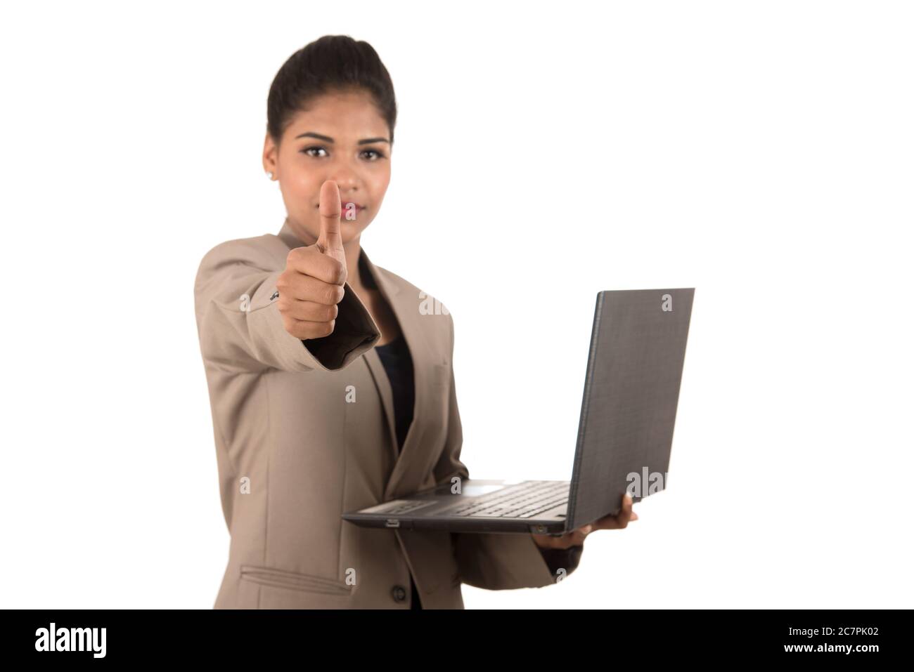 Happy excited business woman holding laptop and showing thumbs up ...
