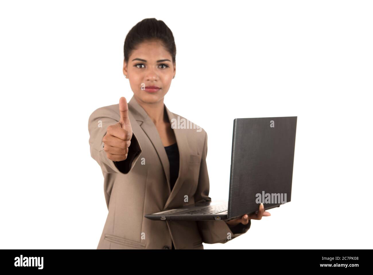 Happy excited business woman holding laptop and showing thumbs up ...