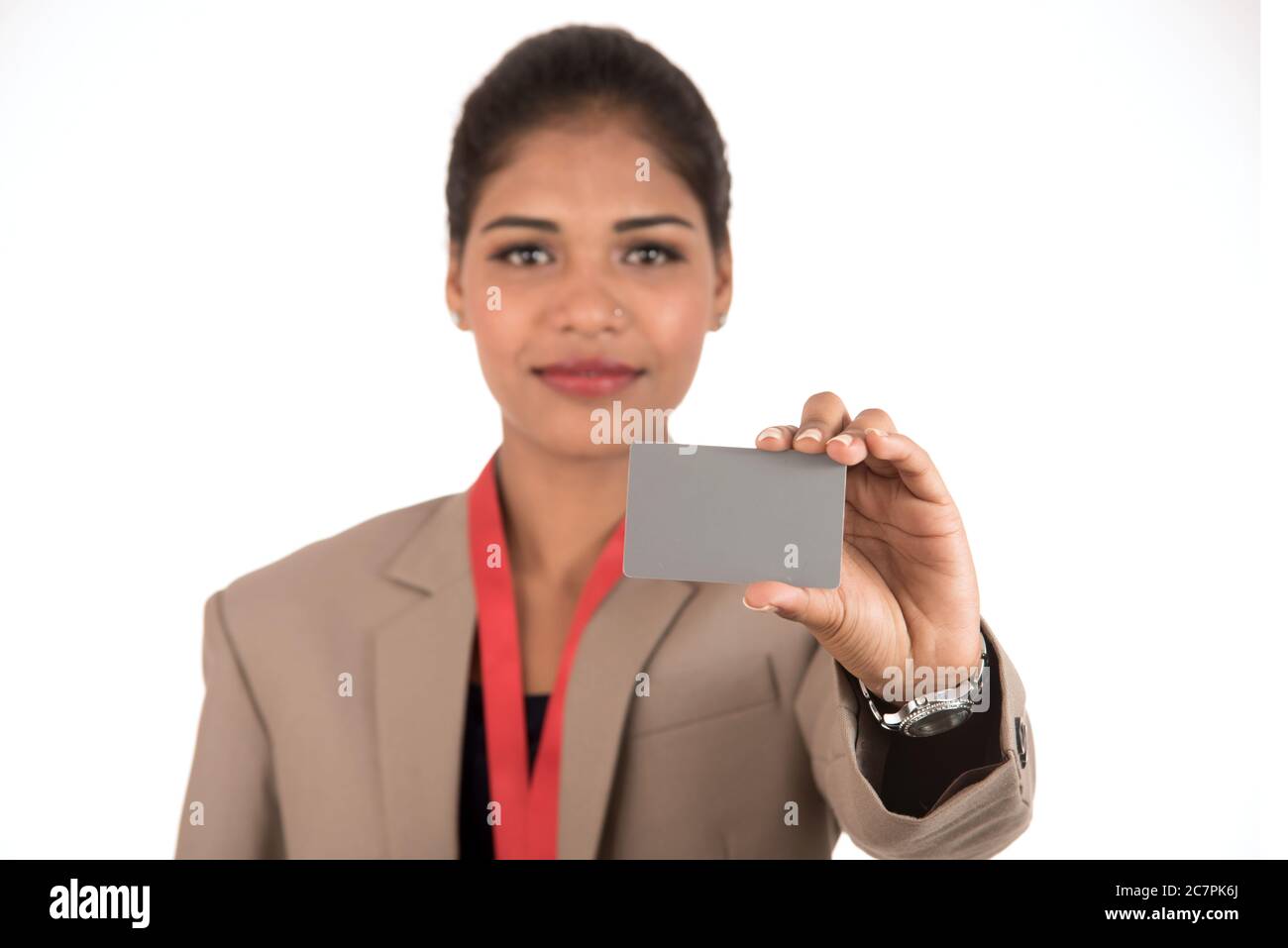 Smiling business woman holding a blank business card or ID card over