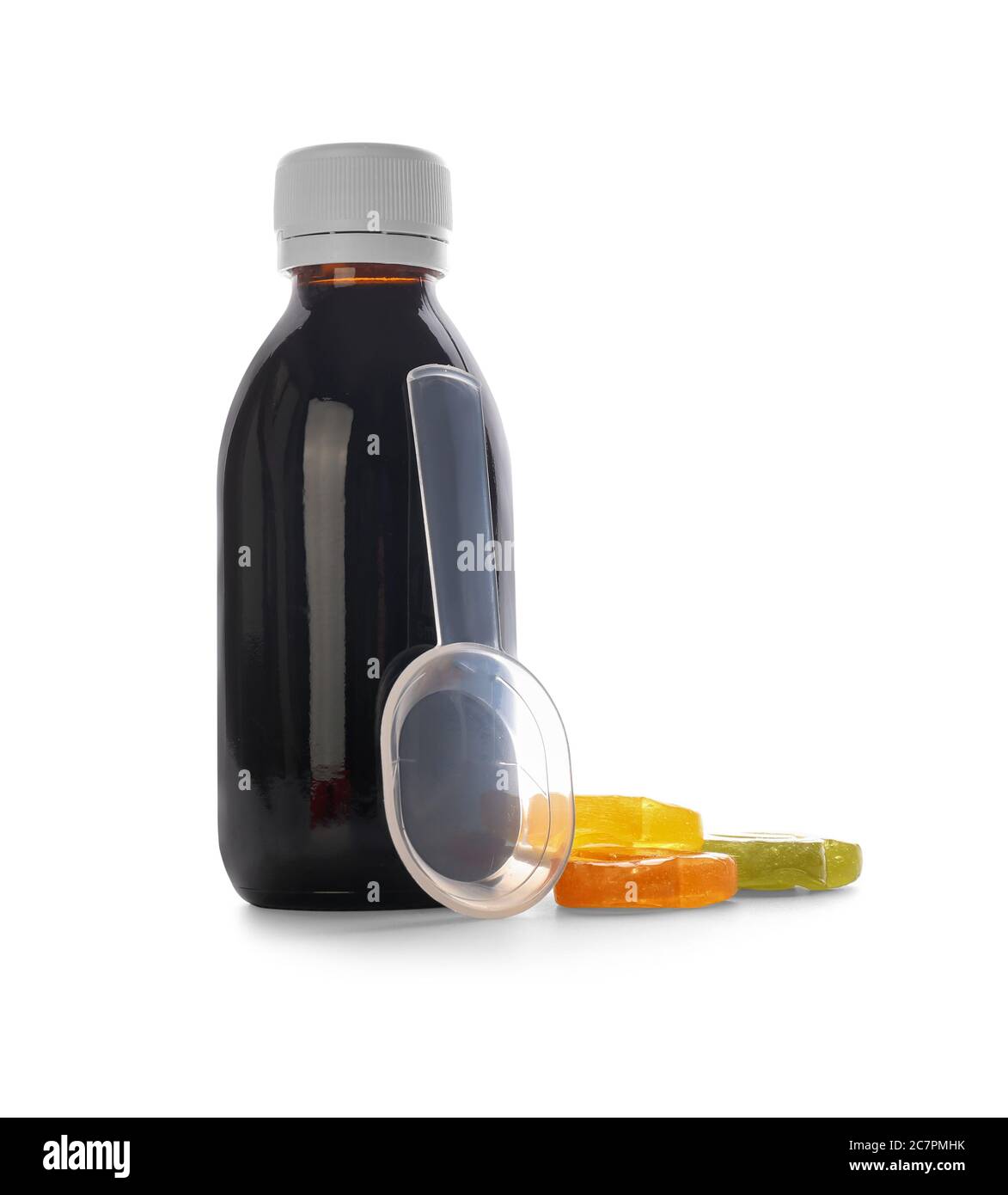 Bottle of cough syrup with candies on white background Stock Photo Alamy