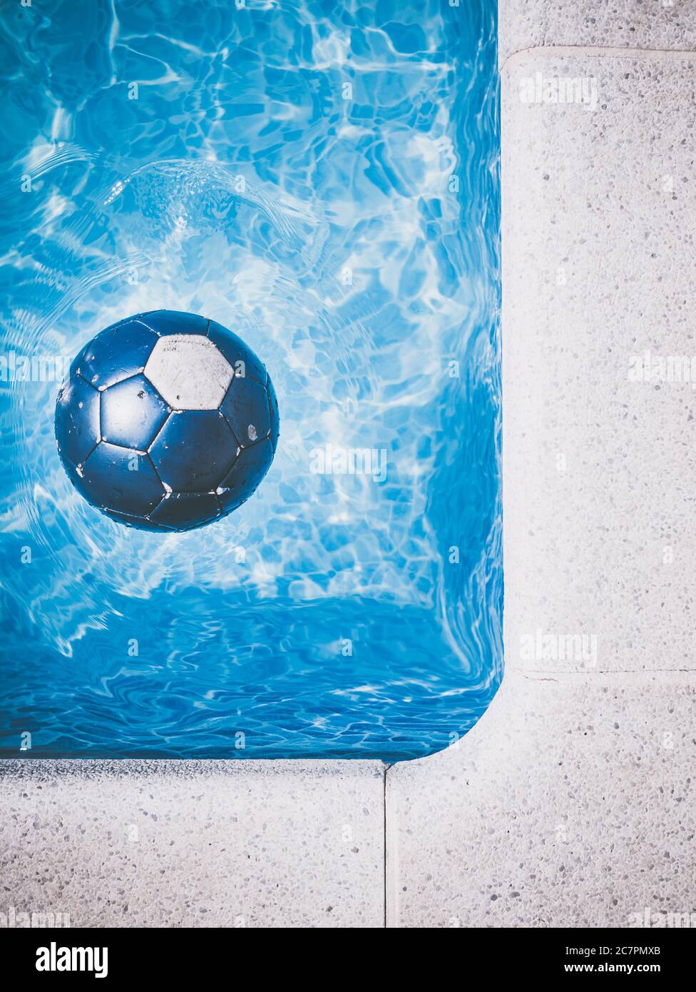 Blue soccer ball in the swimming pool Stock Photo
