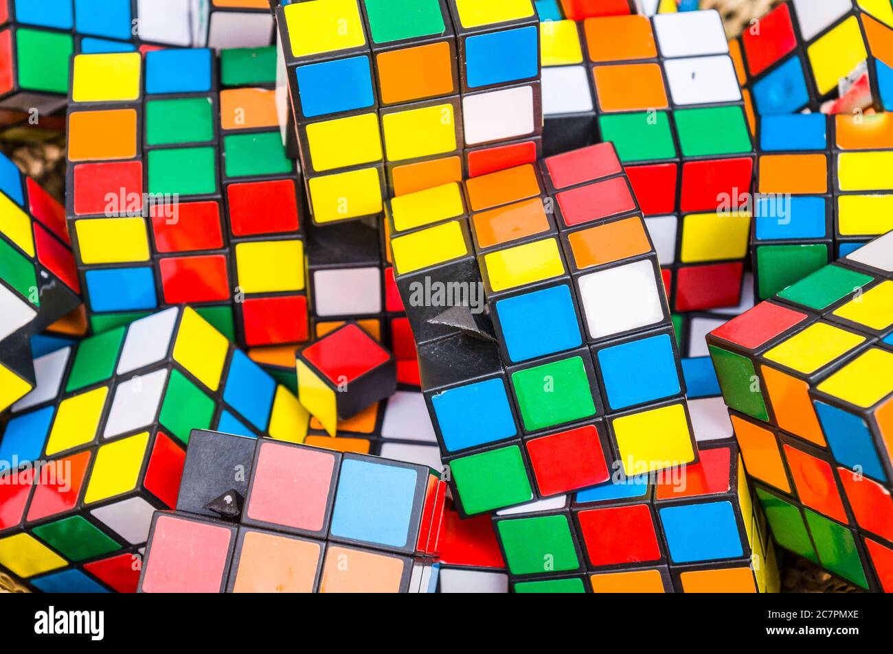 Bunch of Rubik's cube showing their random colors on each side Stock Photo  - Alamy