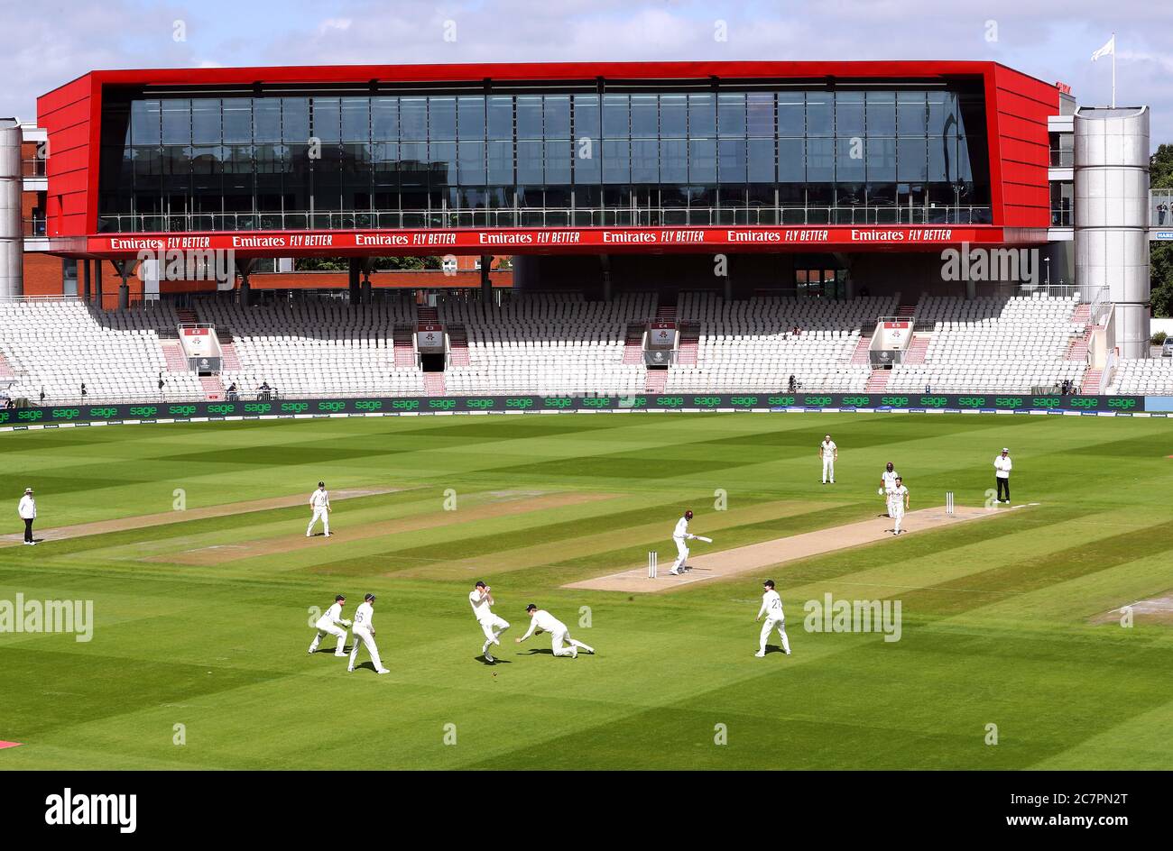 England’s Ben Stokes (left of ball) and Zak Crawley (right of ball) fail to take a catch in the slips from West Indies’ Alzarri Joseph off the bowling of Chris Woakes during day four of the Second Test at Emirates Old Trafford, Manchester. Stock Photo