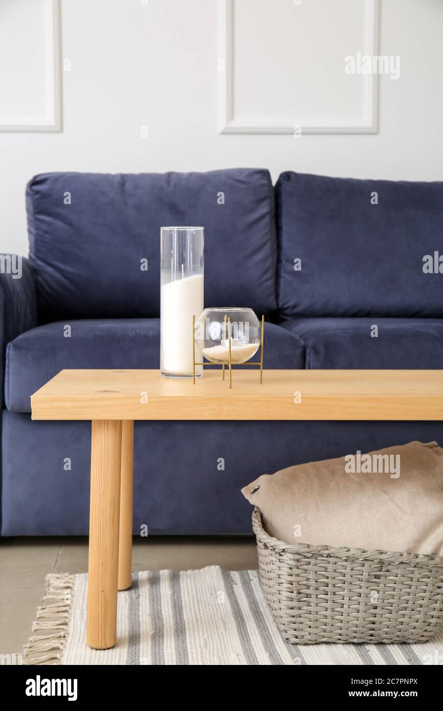 Stylish interior of living room with sofa and table Stock Photo - Alamy