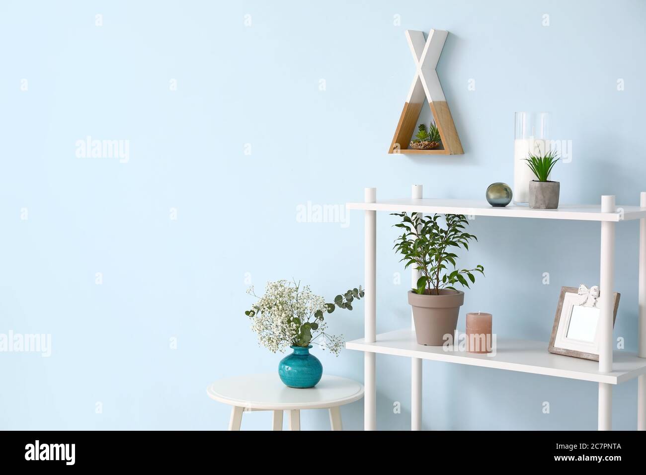 Colorful Wall Rack Stylish rack with decor near color wall Stock Photo - Alamy