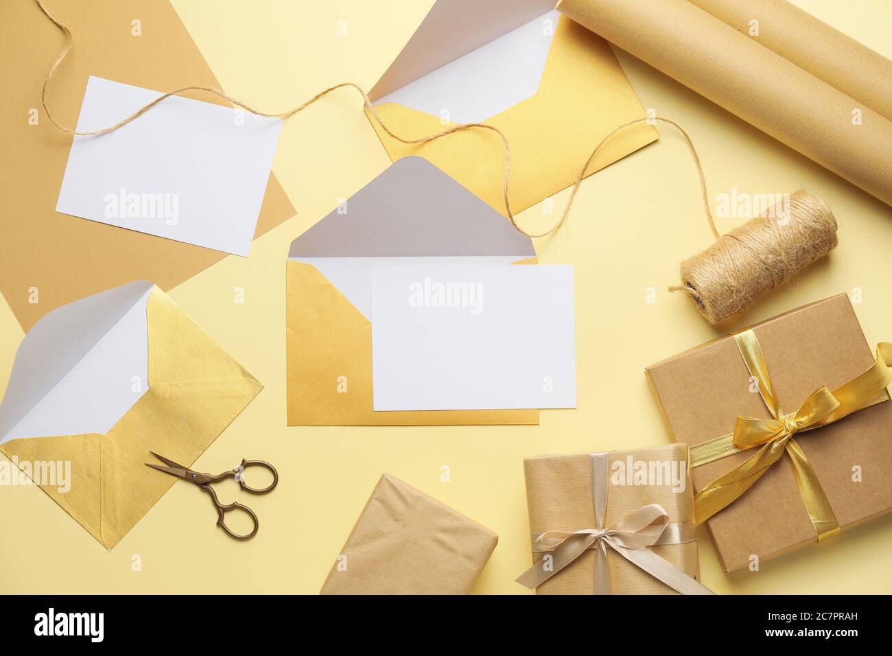 Composition with blank cards, gifts and envelopes on color background Stock Photo