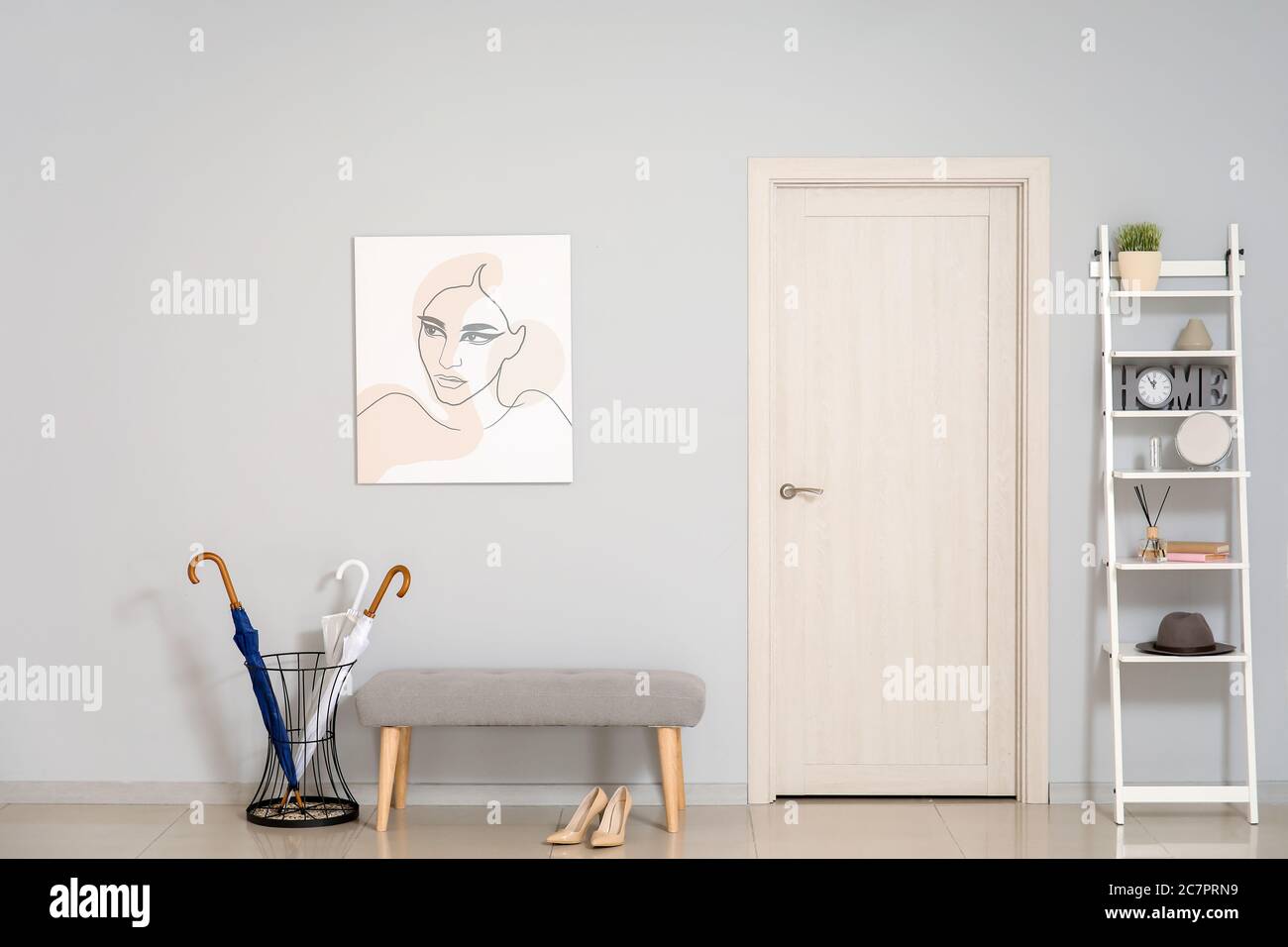 Stylish interior of hall with bench and rack Stock Photo - Alamy
