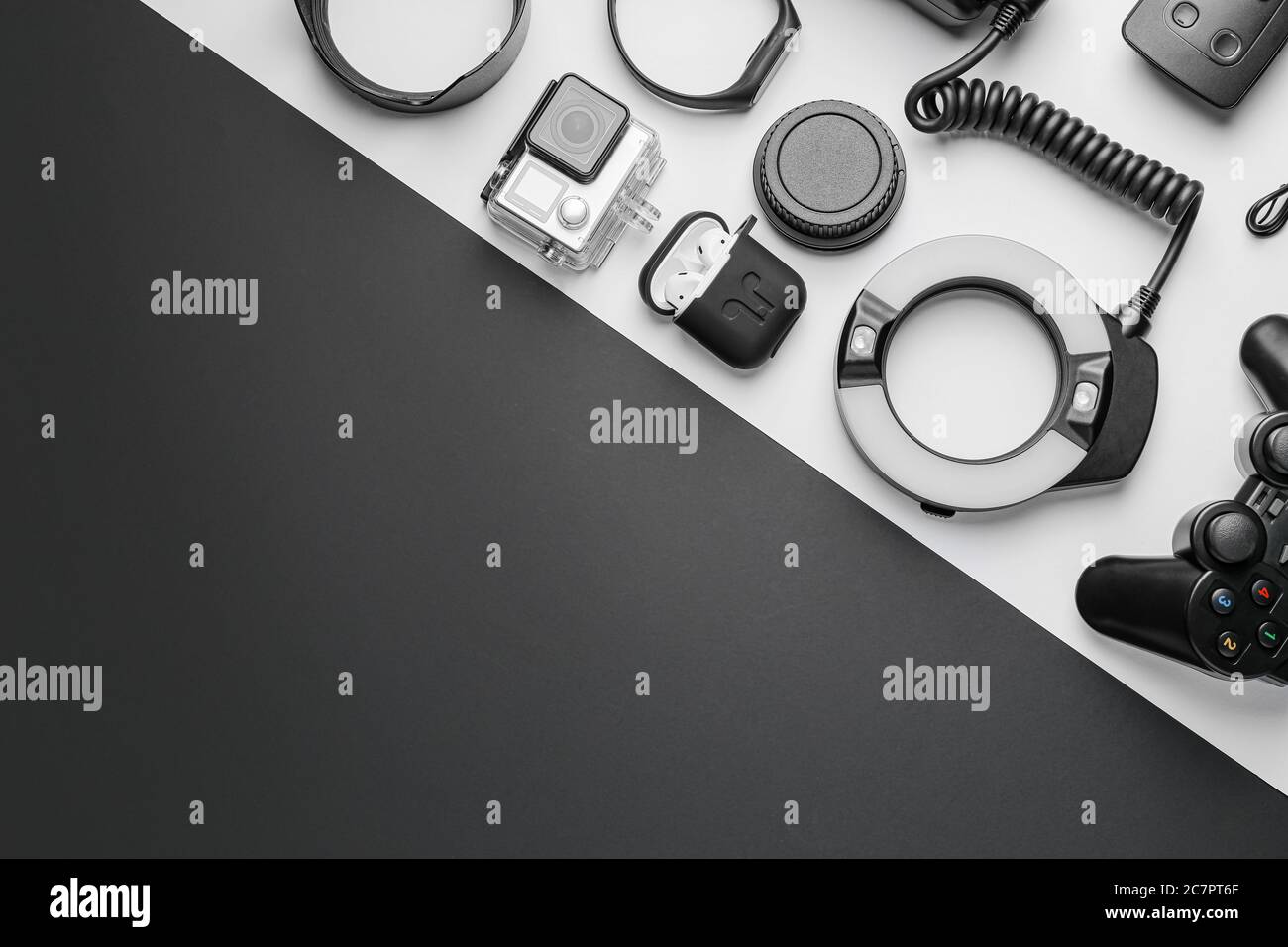 Different modern devices on black and white background Stock Photo