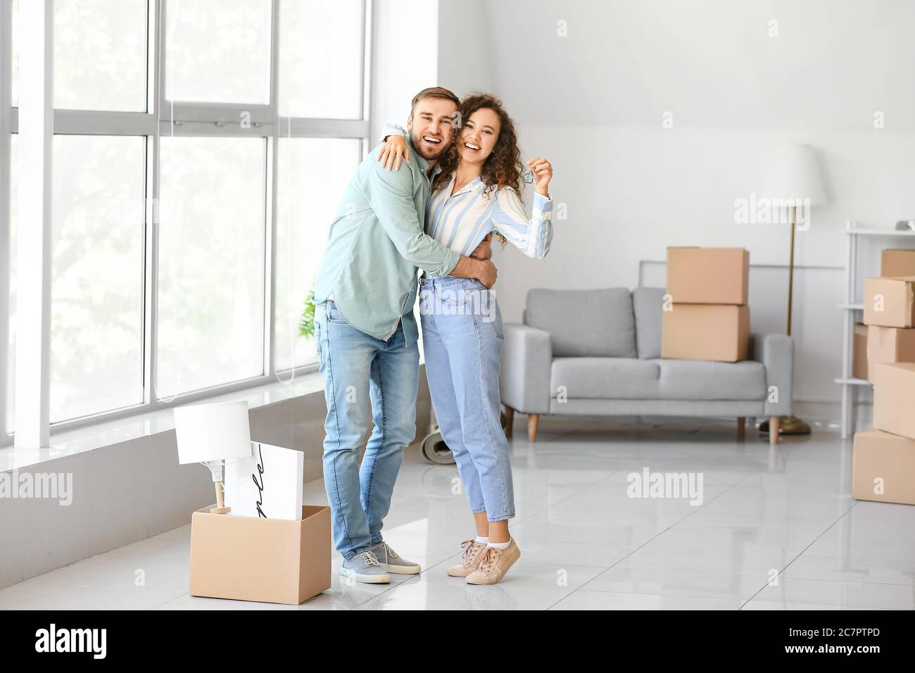 Young couple in their new flat on moving day Stock Photo - Alamy