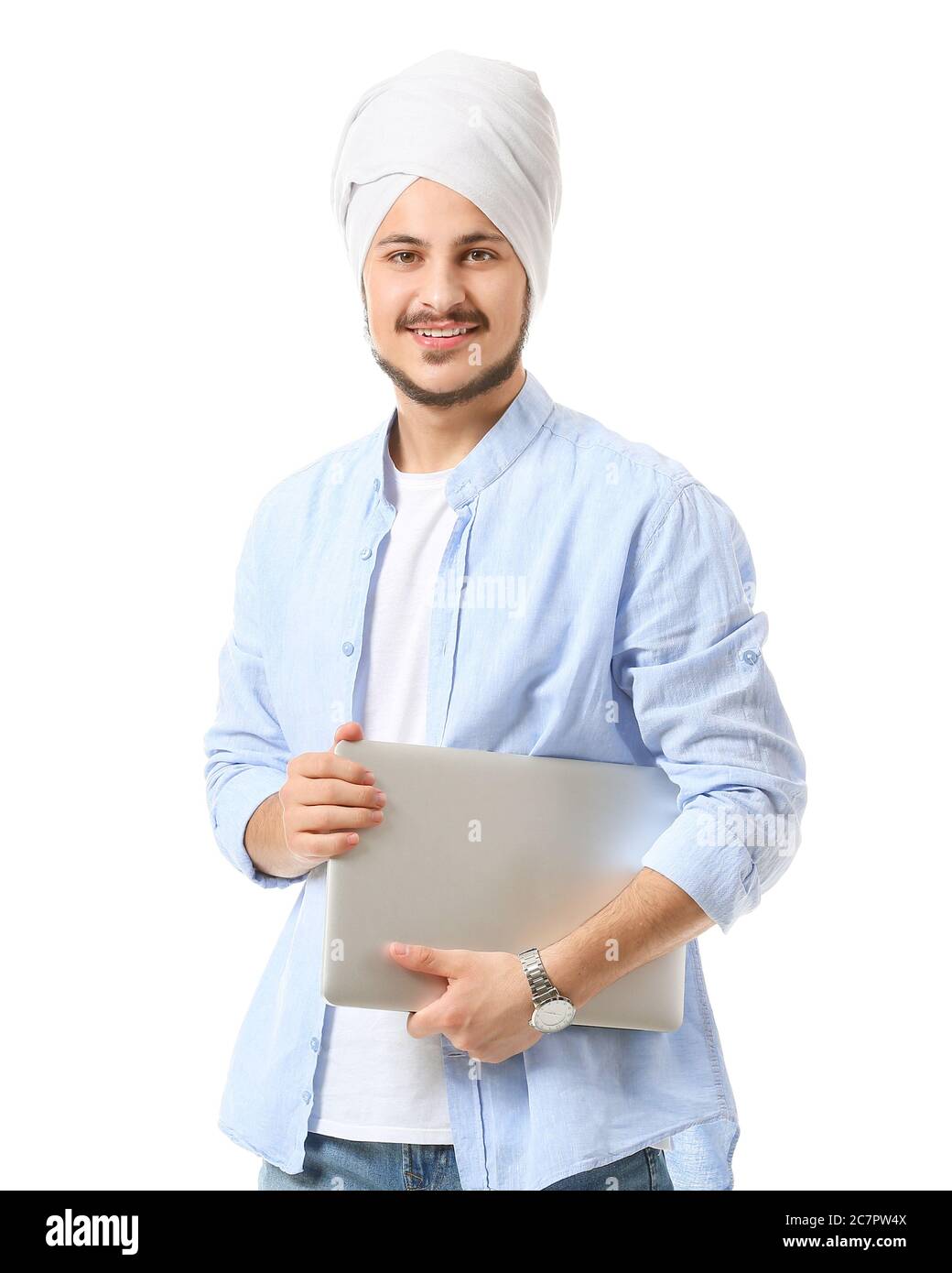 Handsome young Indian man with laptop on white background Stock Photo