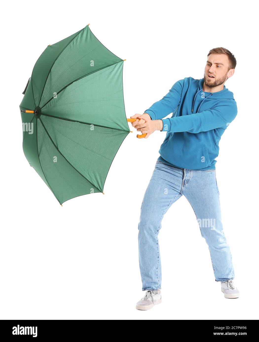 Handsome young man with umbrella on white background Stock Photo - Alamy