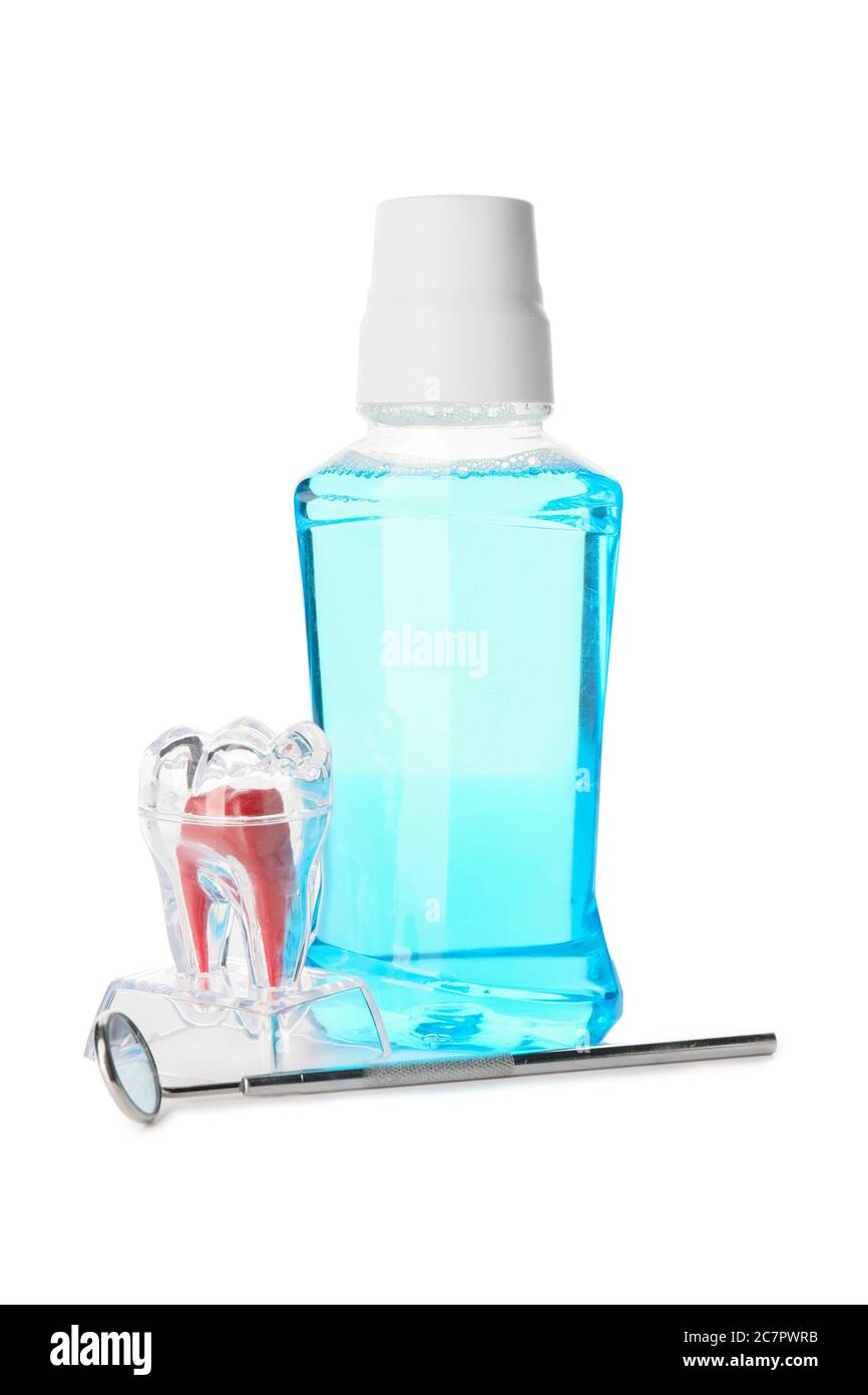 Mouthwash with dental mirror on white background Stock Photo Alamy