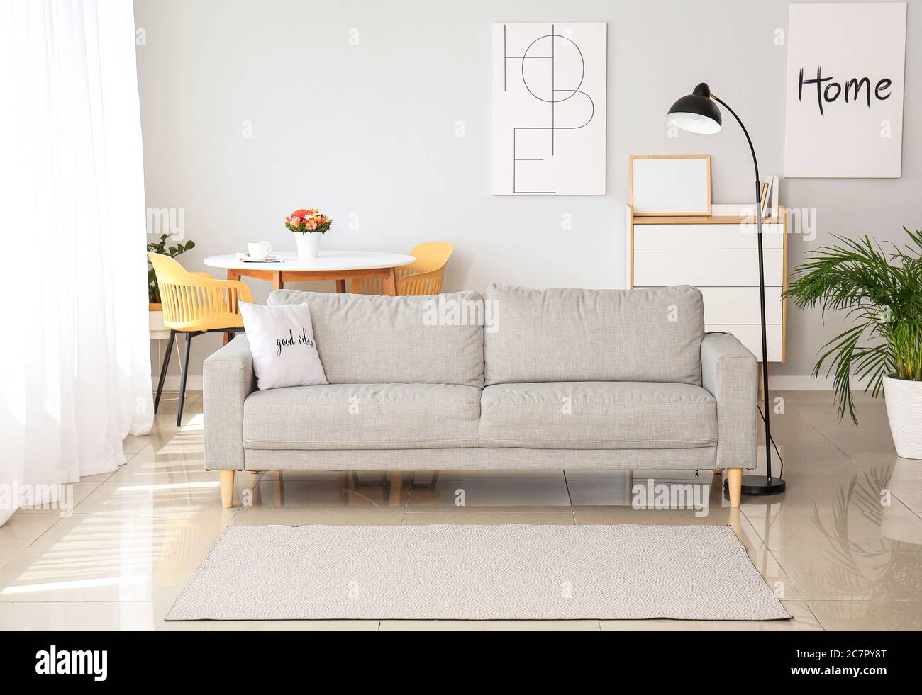 Stylish interior of modern living room with sofa Stock Photo - Alamy