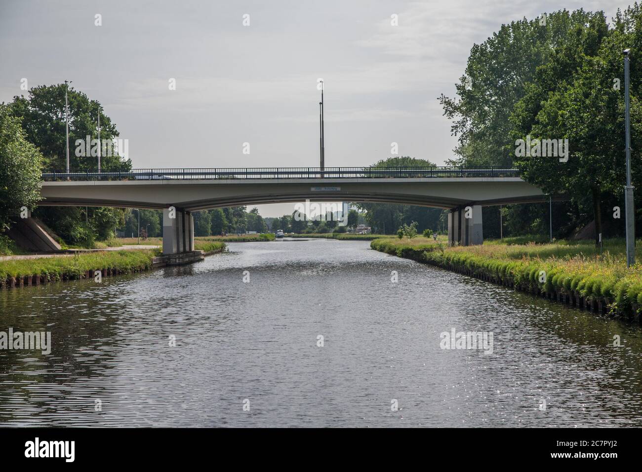 Two ways of transport crossing each other i.e. road and water. Stock Photo