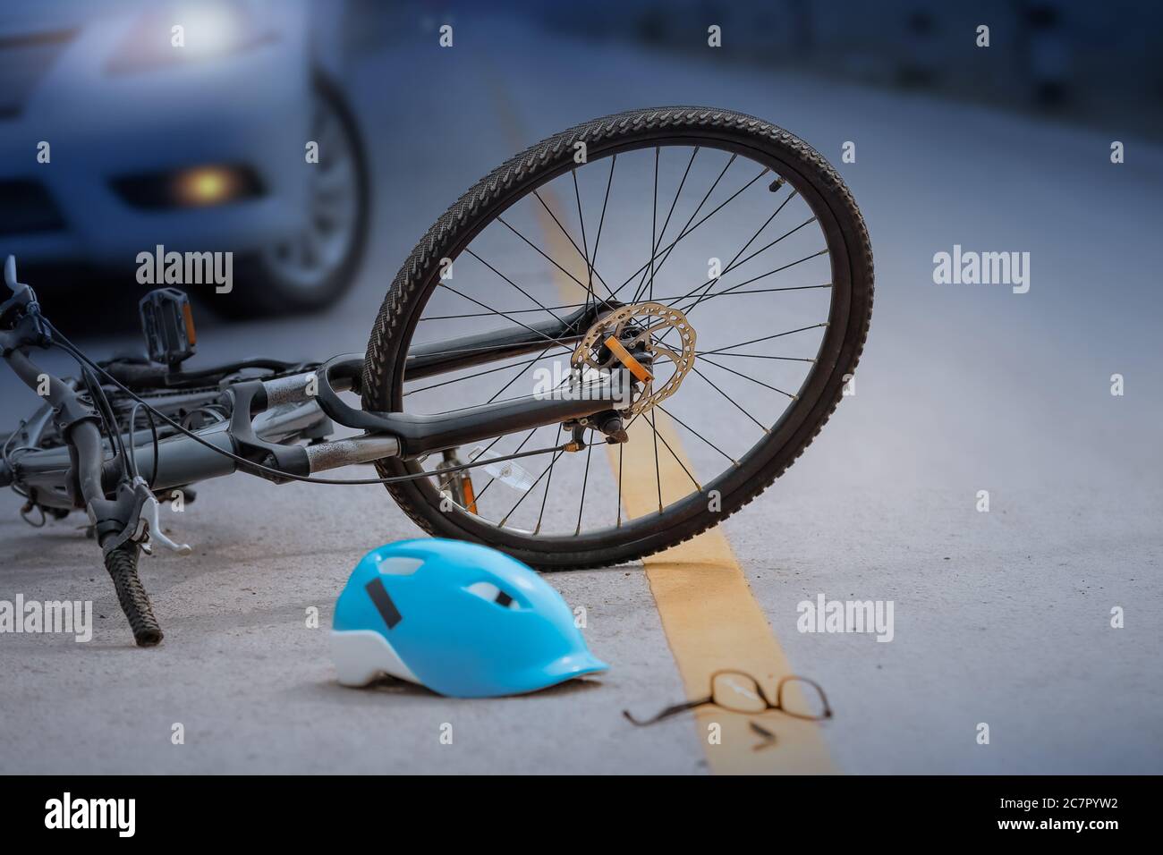 Accident car crash with bicycle on road ,nighttime Stock Photo