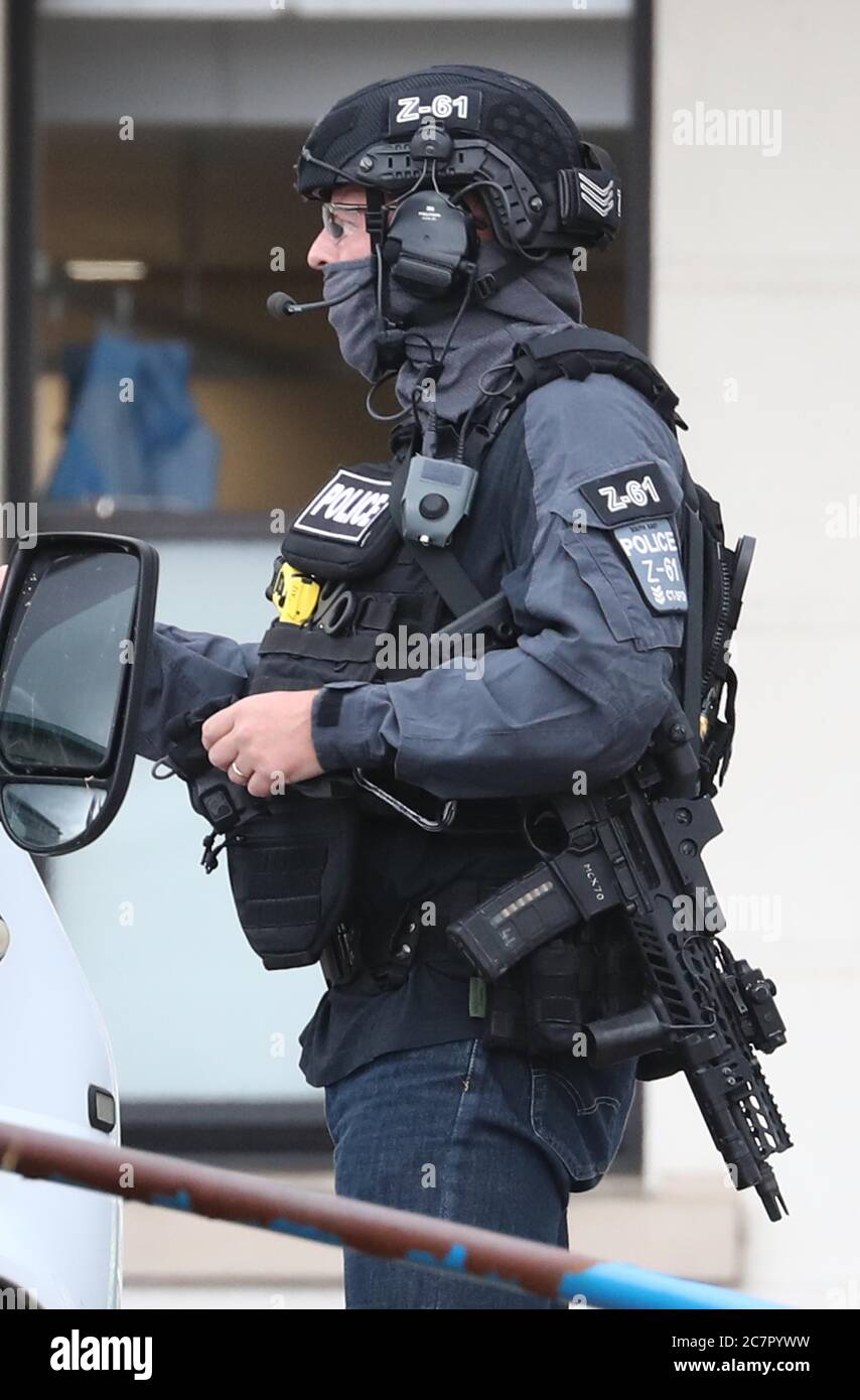 A Counter Terrorist Specialist Firearms Officer at the Royal Sussex County Hospital in Brighton, a man has been arrested on suspicion of attempted murder after a member of hospital staff was stabbed, according to police. Stock Photo