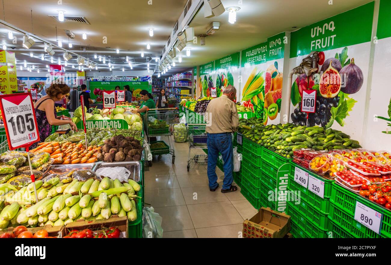 Yerevan , Armenia - August 16, 2019 :   people bying groceries  in a local supermarket Stock Photo