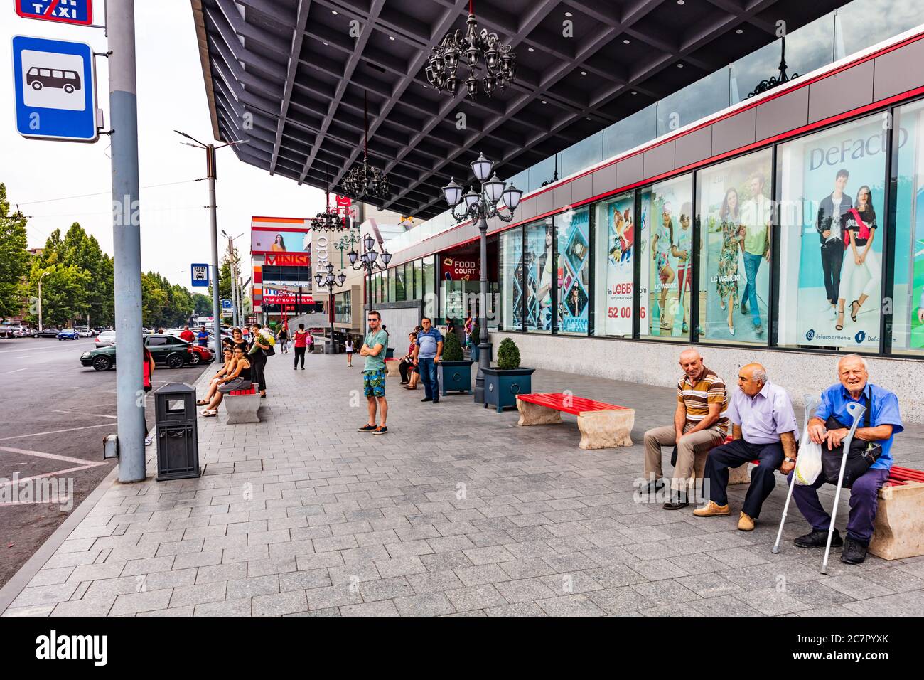 Yerevan , Armenia - August 16, 2019 :  people waiting for the bus in front of a shopping mall on Tigran mes avenue Stock Photo