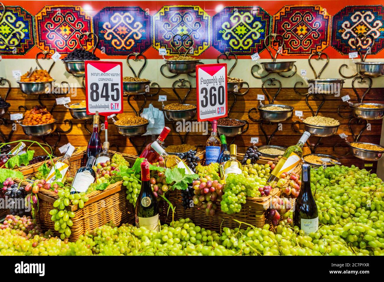 Yerevan , Armenia - August 16, 2019 :   supermarket stall with grappes and wines Stock Photo