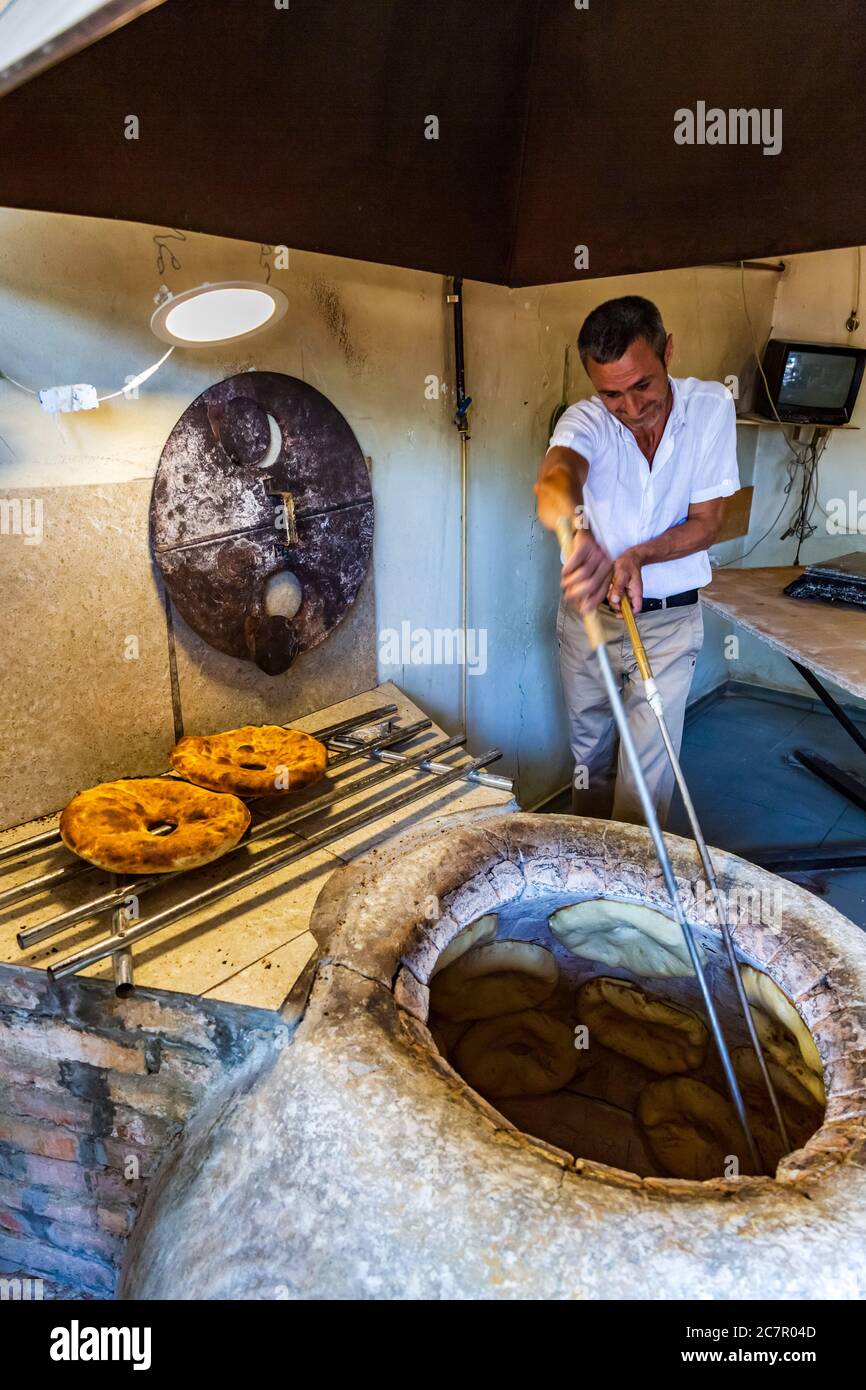 Baker Making Turkish Pita Bread in Tandoor Clay Oven. Baking Process Stock  Image - Image of bakery, grain: 134048681