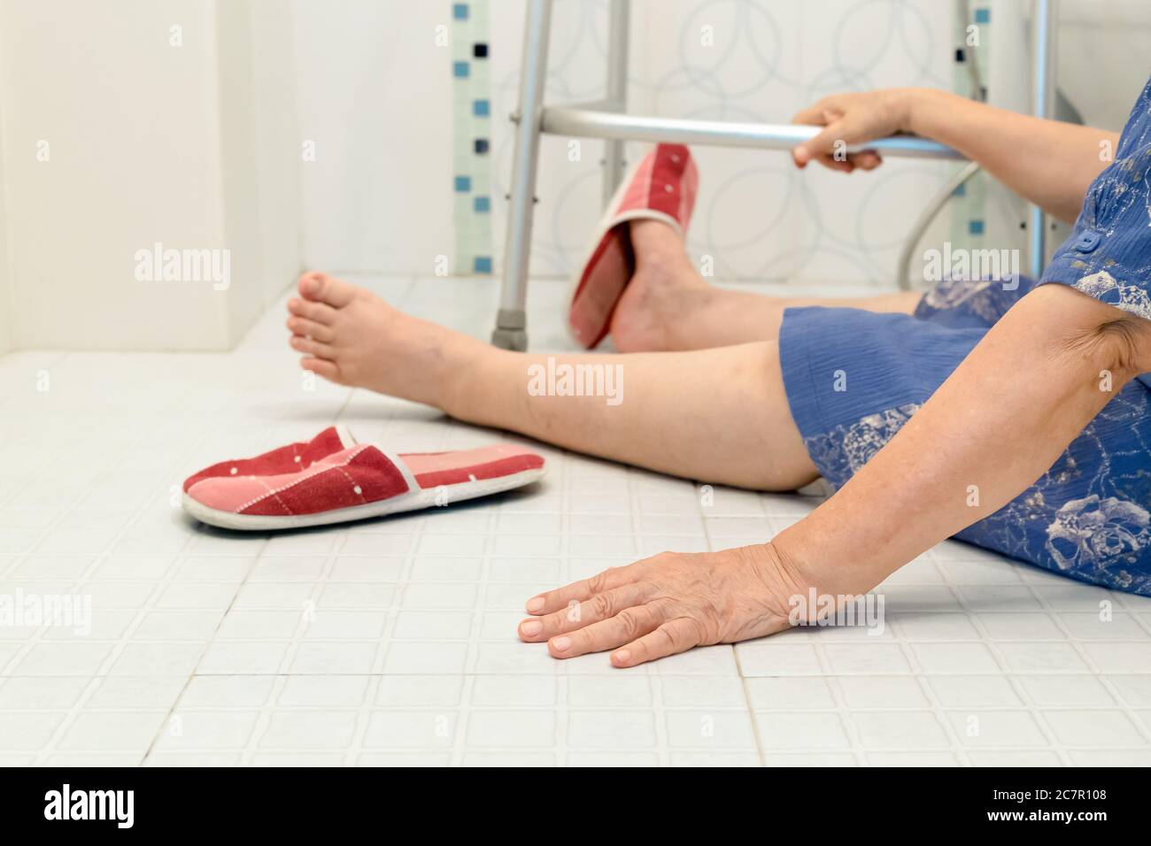 elderly falling in bathroom because slippery surfaces Stock Photo