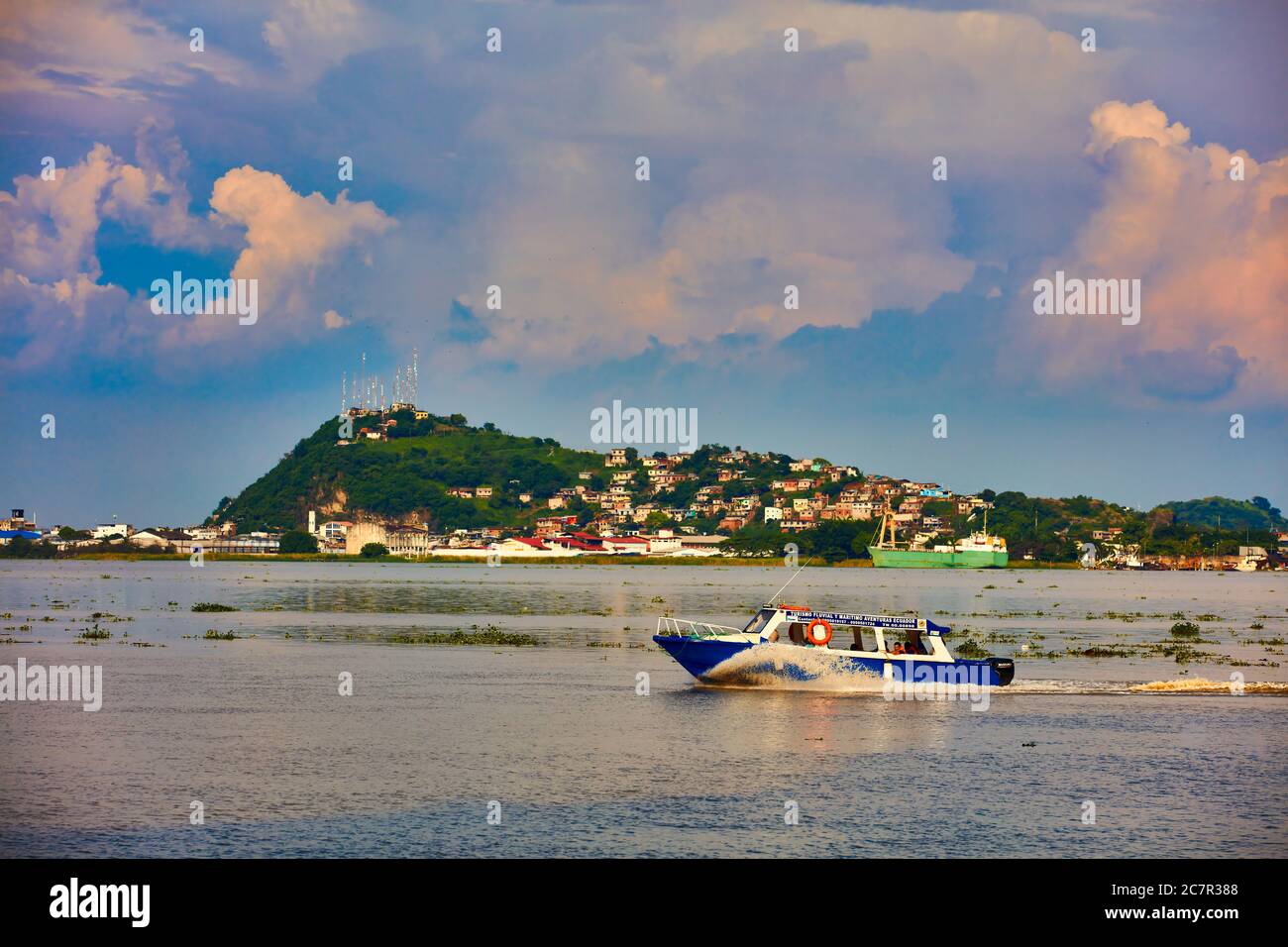 Guayaquil , Ecuador- March 7 , 2020 :  shuttle boat taxi on the Guayaquil river at sunset Stock Photo