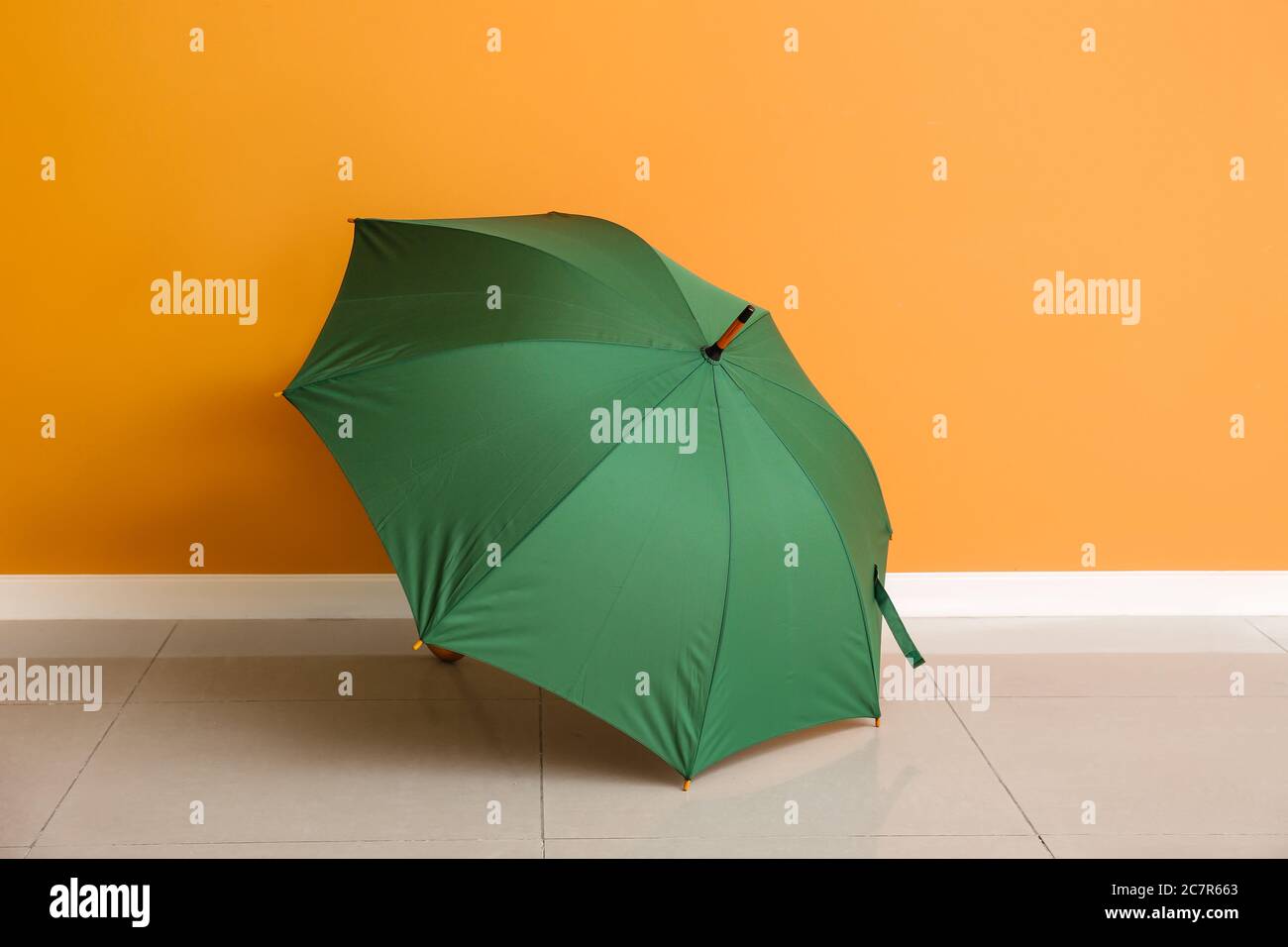 Stylish umbrella near color wall Stock Photo Alamy