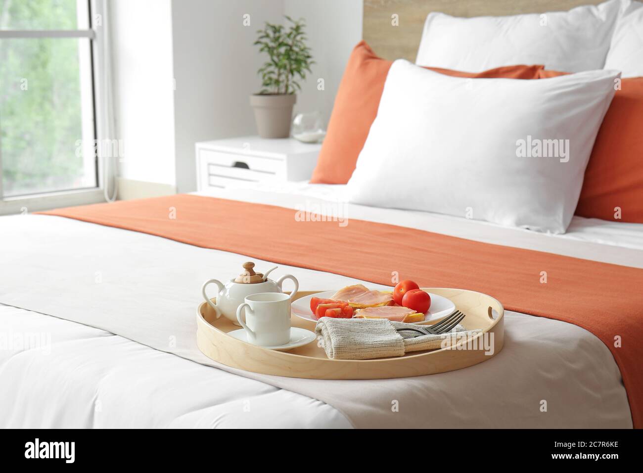 Tray with tasty breakfast on bed in hotel room Stock Photo - Alamy