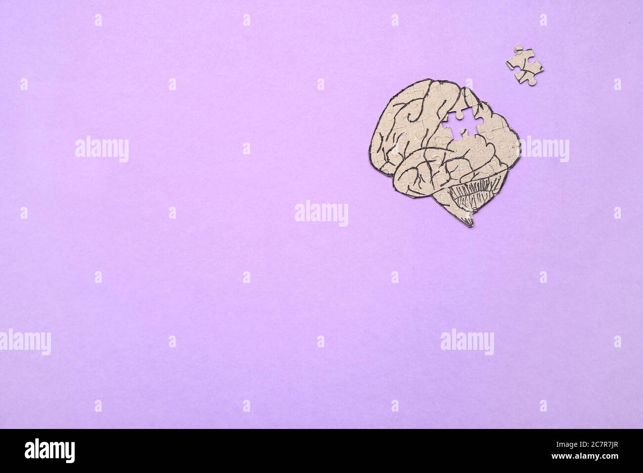Puzzle in shape of human brain on color background. Concept of dementia Stock Photo