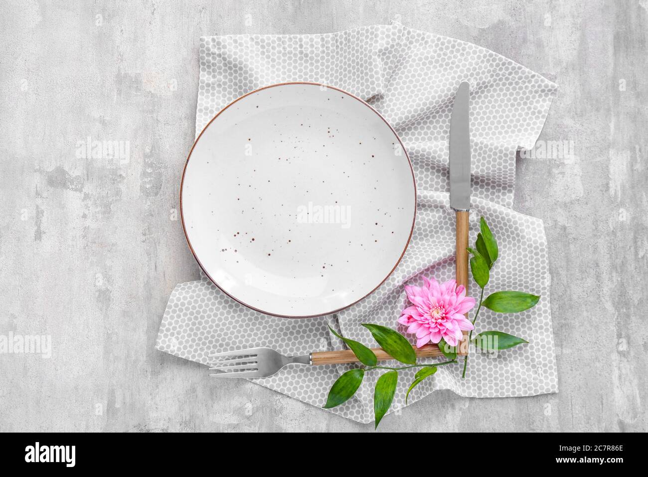 Beautiful table setting on grey background Stock Photo
