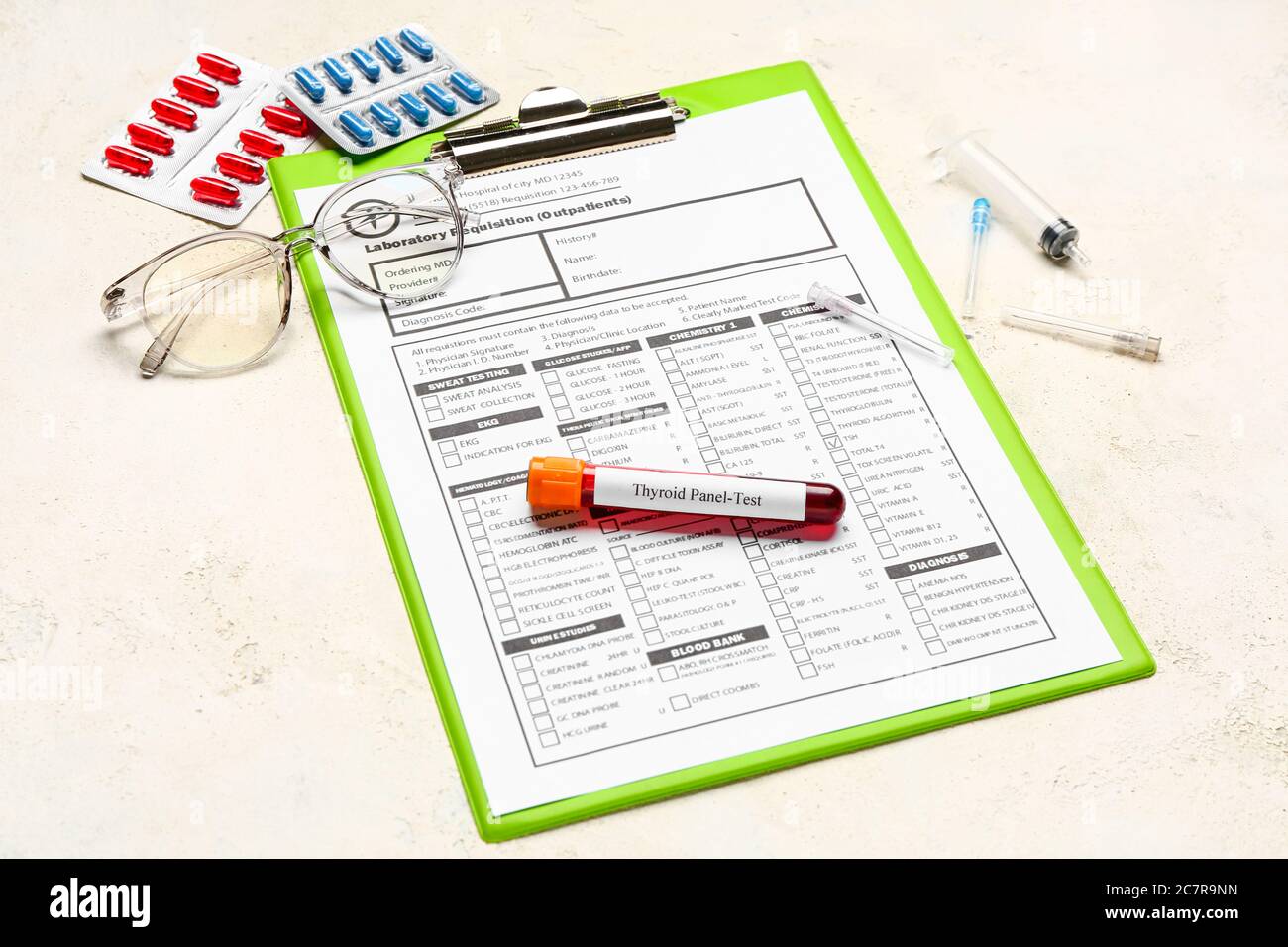 Blood sample in tube with pills and laboratory test form on white ...