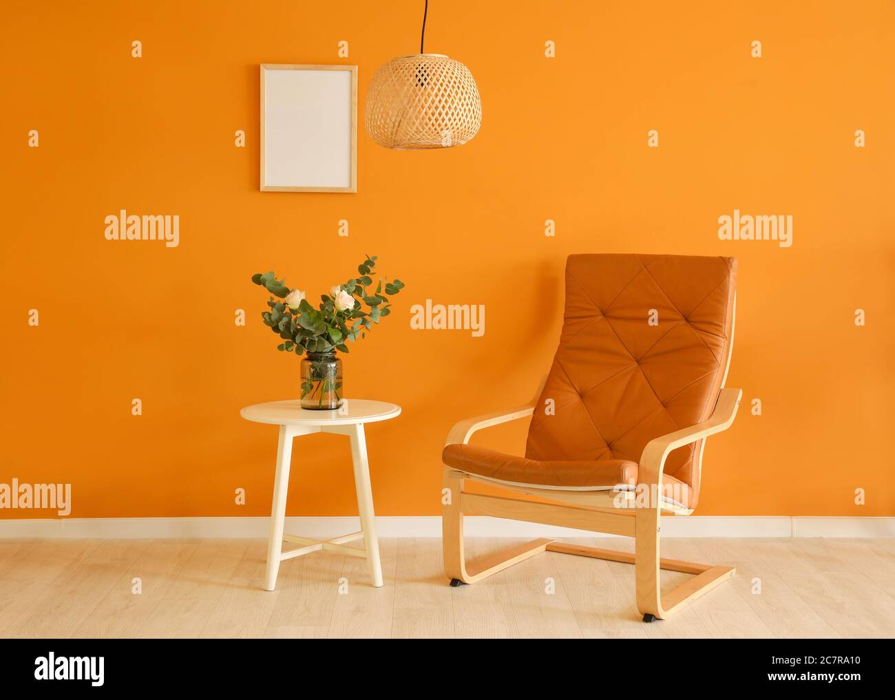Interior of room with table and armchair Stock Photo - Alamy