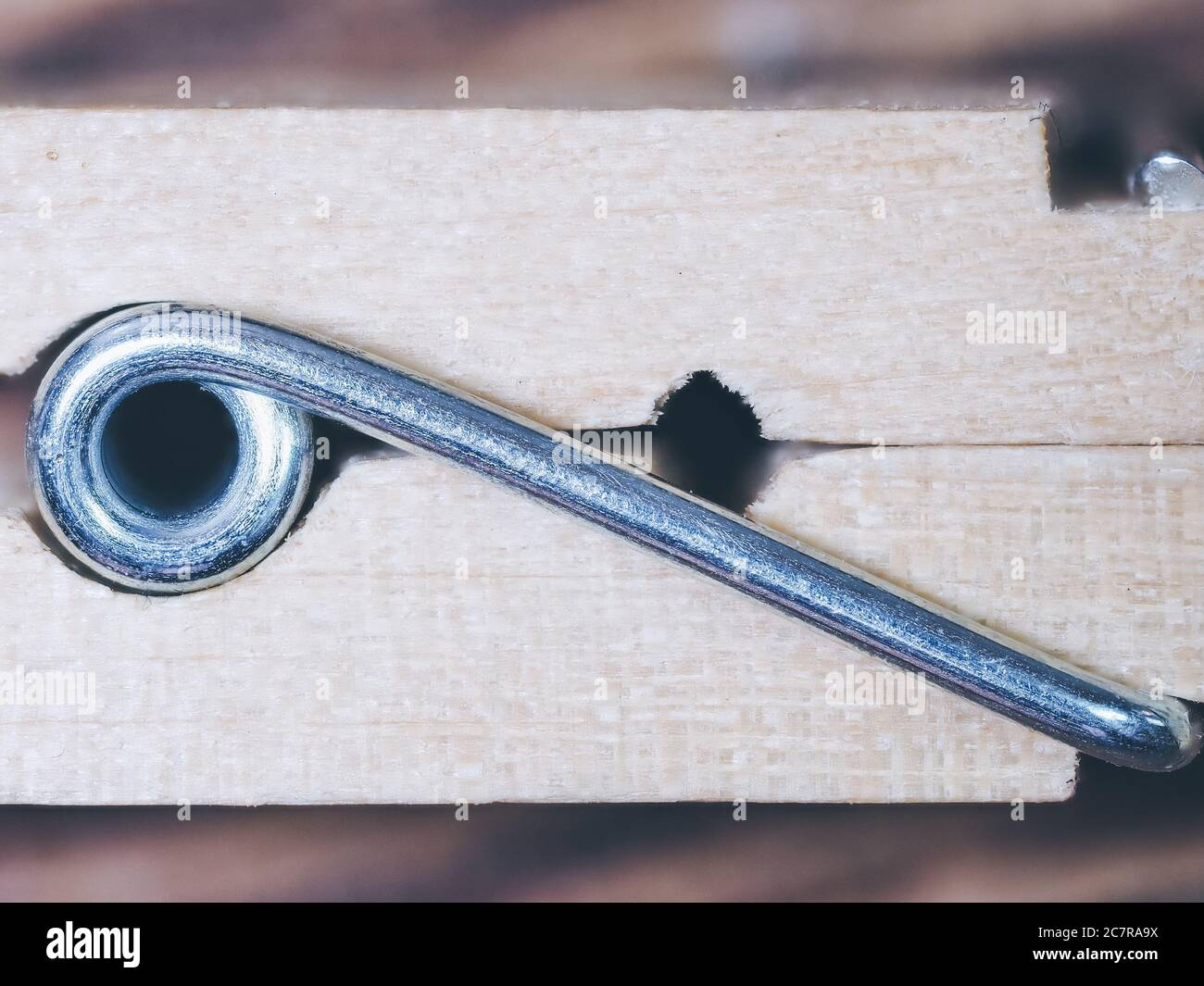 Closeup side view of the metal on a wooden clothespin Stock Photo Alamy