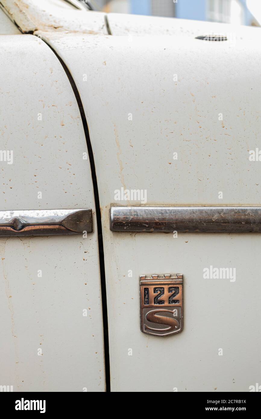 Volvo 122S Sedan car side with badge with dust parked in Playa San Juan, Tenerife, Canary Islands, Spain Stock Photo