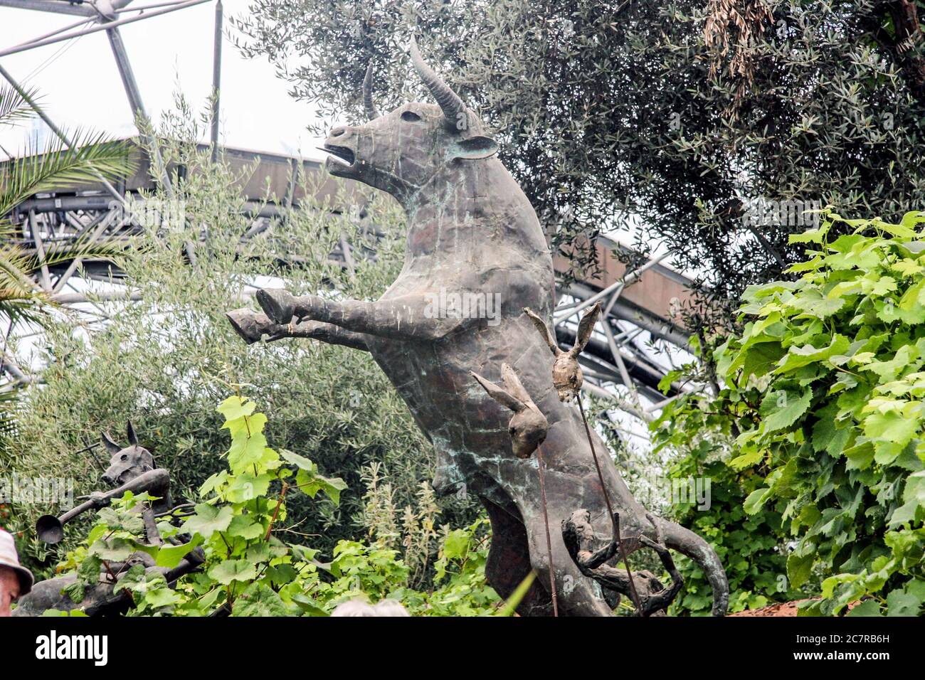 Part of the Rites of Dionysus scuptures by Tim Shaw in the Mediterannean biome at the Eden Project in Cornwall. The educational charity has always inc Stock Photo