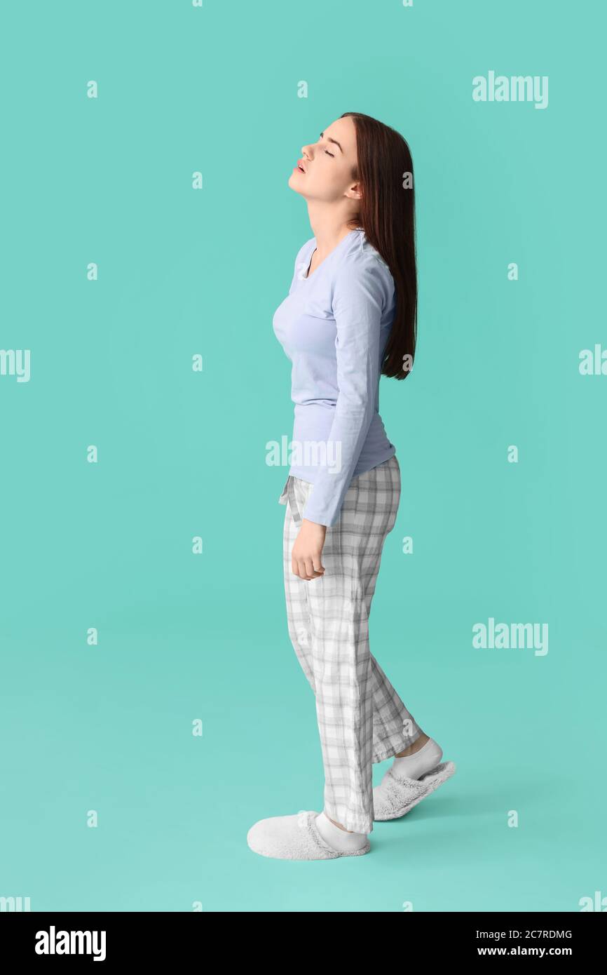 Female sleepwalker on color background Stock Photo