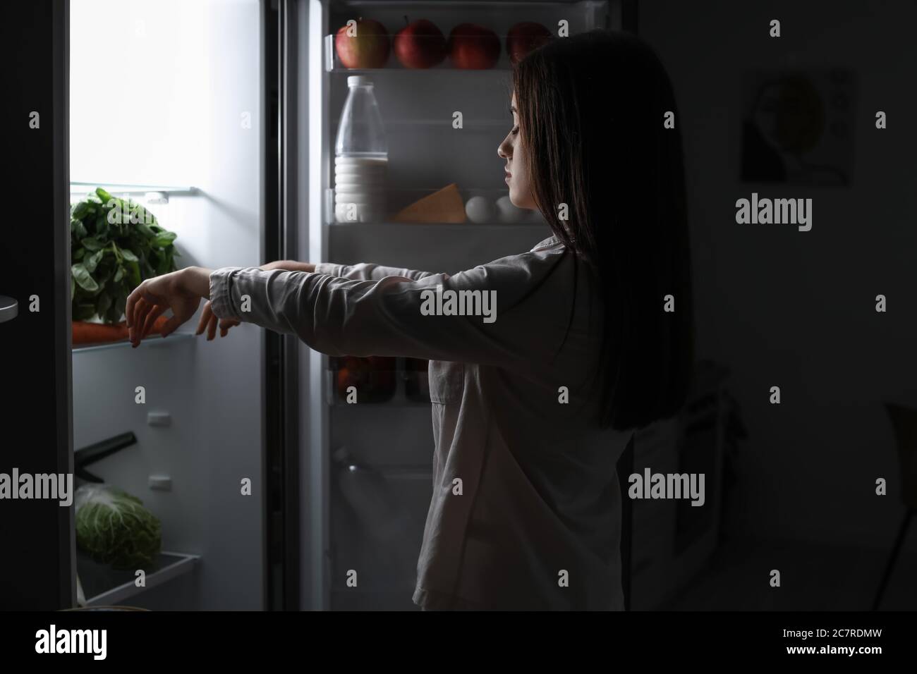 Female sleepwalker near fridge at night Stock Photo Alamy