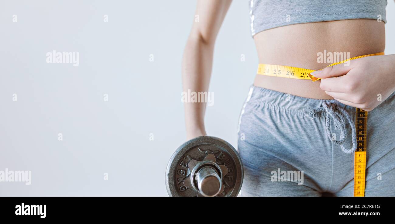 Young woman loses weight doing fit exercises Stock Photo Alamy