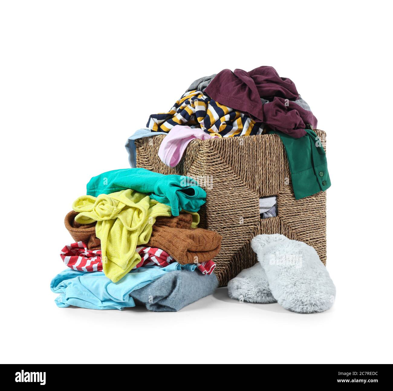 Basket with dirty clothes on white background Stock Photo - Alamy