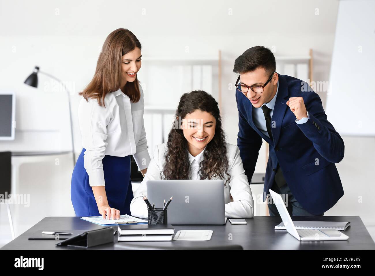 Young business people working in office Stock Photo - Alamy