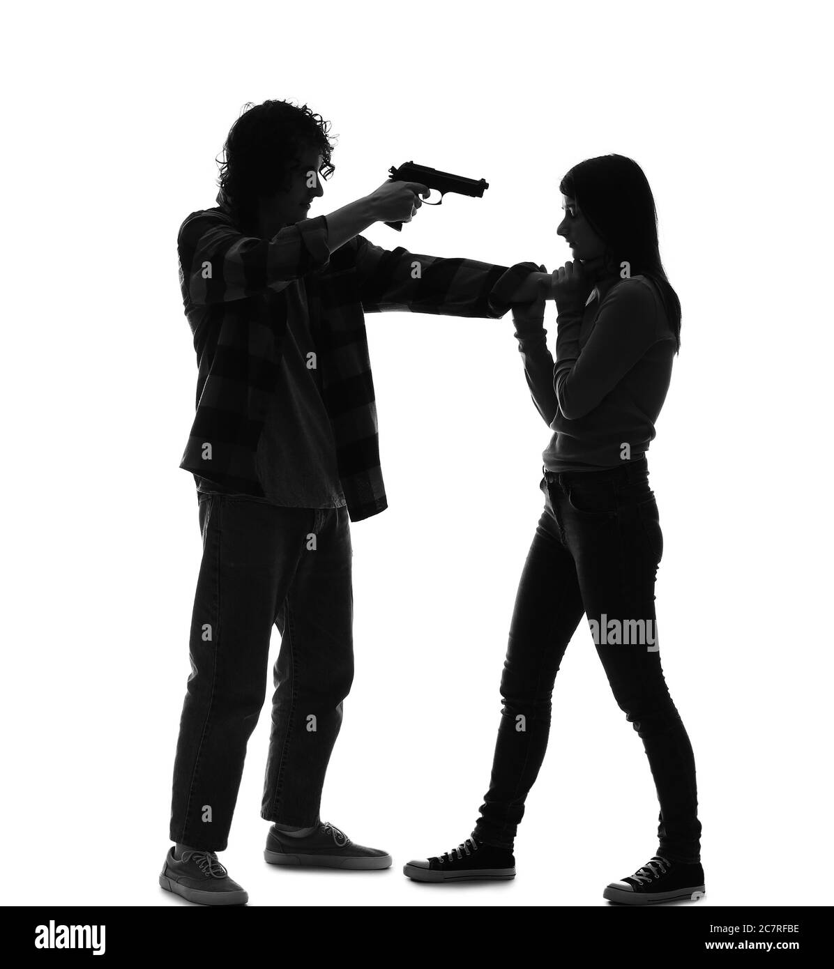 Silhouette of maniac with gun and his victim on white background Stock Photo