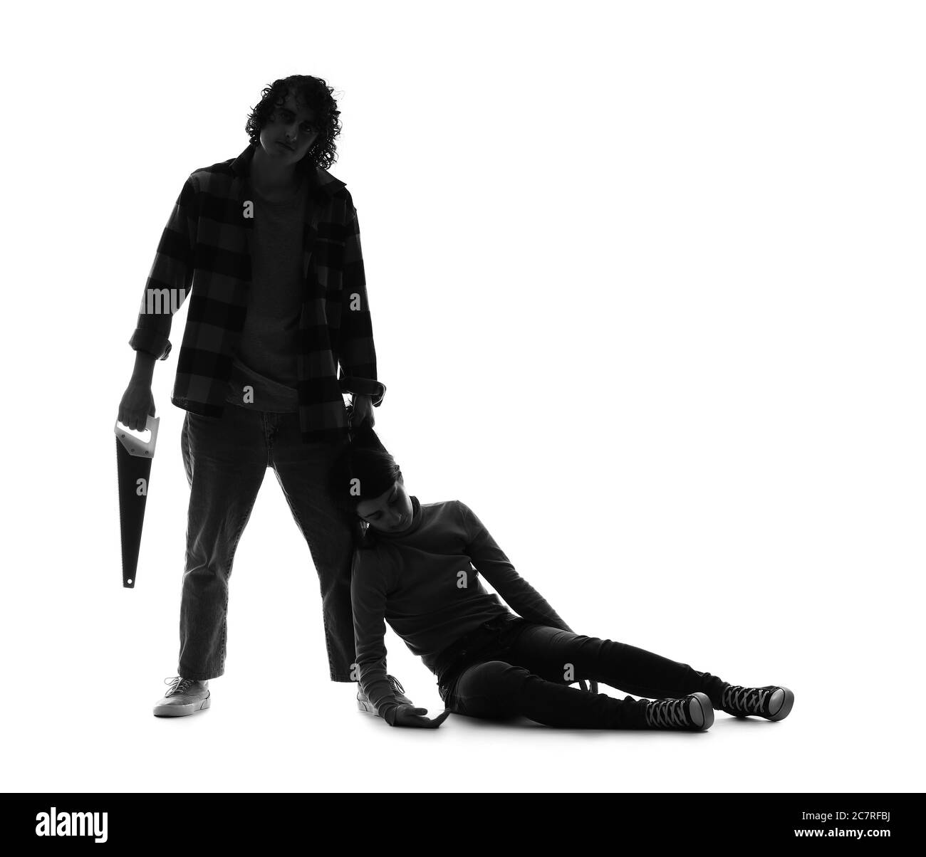 Silhouette of maniac with saw and his victim on white background Stock Photo