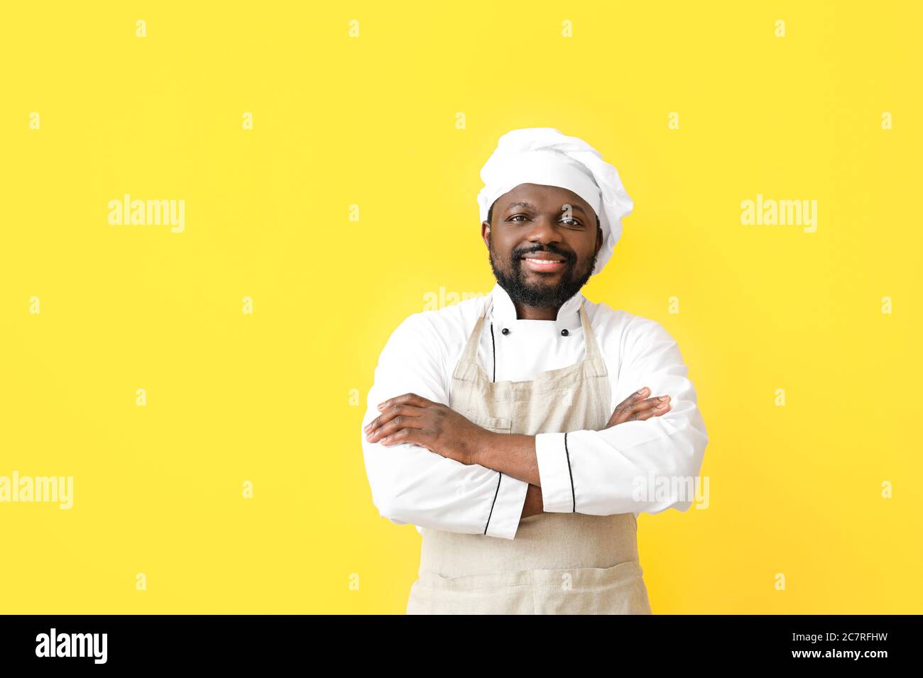 Male African-American chef on color background Stock Photo - Alamy